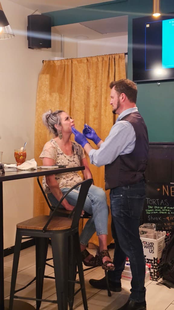 Ryan Kent FNP performing live treatment demo Hello Gorgeous Med Spa