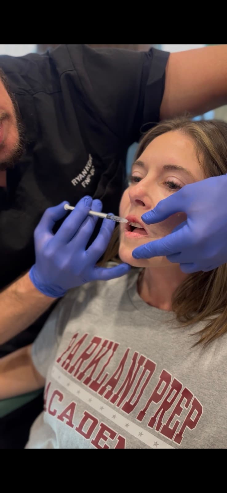 Ryan Kent, FNP-BC treating a guest at a Hello Gorgeous studio event