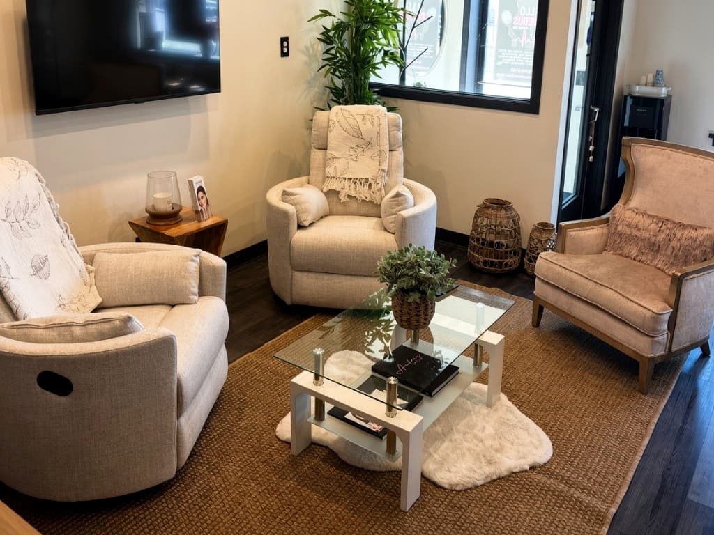 Hello Gorgeous Med Spa waiting lounge in downtown Oswego — cream chairs and the room clients sit in