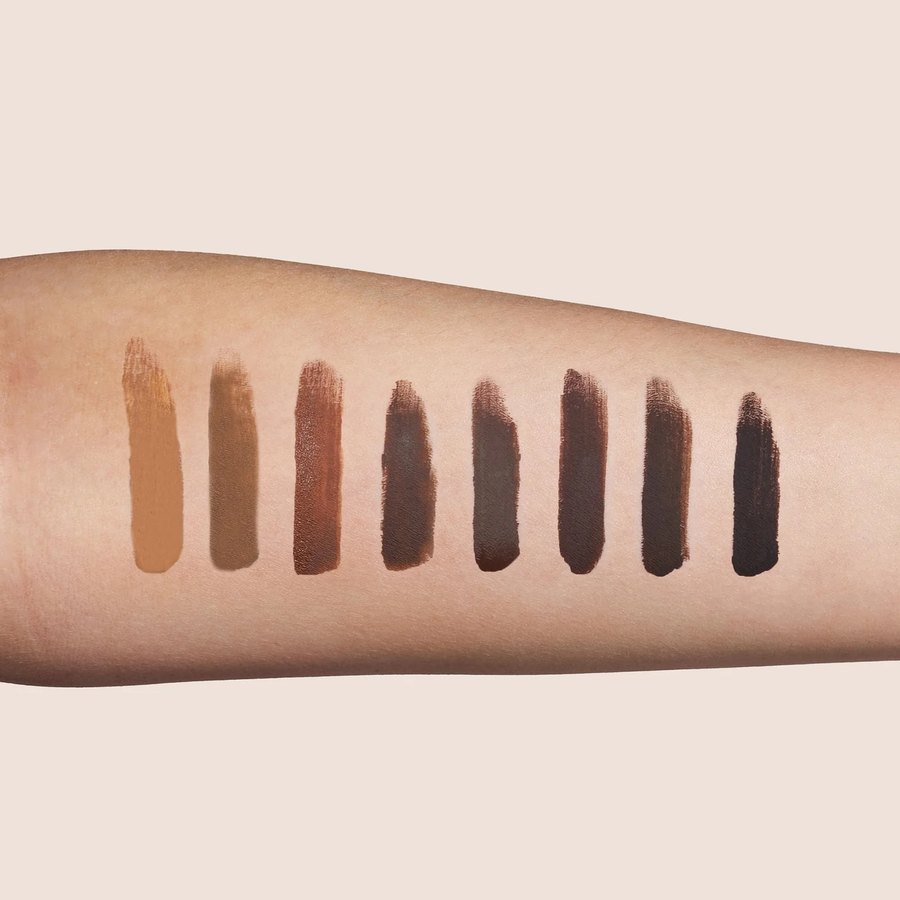 Range of brow pigment shades swatched on skin
